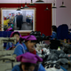 A photograph of North Korean leader Kim Jong Un taken during his visit at Ryuwon Shoe Factory is displayed on the wall of a room at the sports footwear manufacturing facility in Pyongyang, North Korea, Friday, Feb. 1, 2019. (AP Photo/Dita Alangkara)